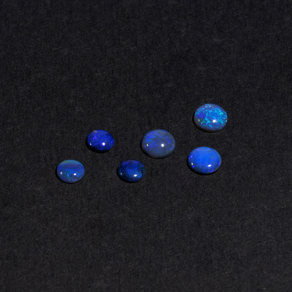 4 to 8mm Lightning Ridge Black Opal Round Cabs – Blue/Purple