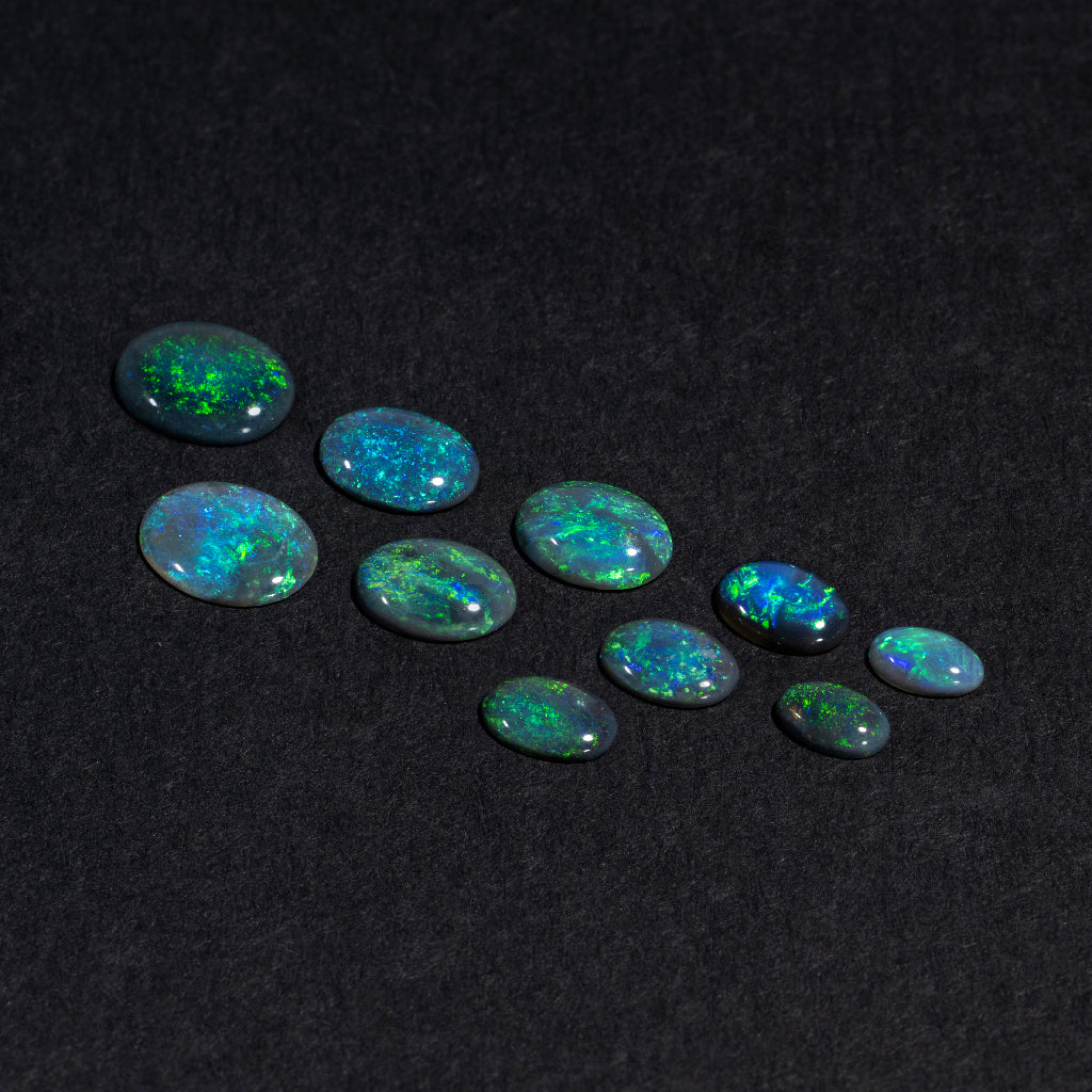 5x3 to 9x7mm Lightning Ridge Black Opal Ovals – Green Play of Color