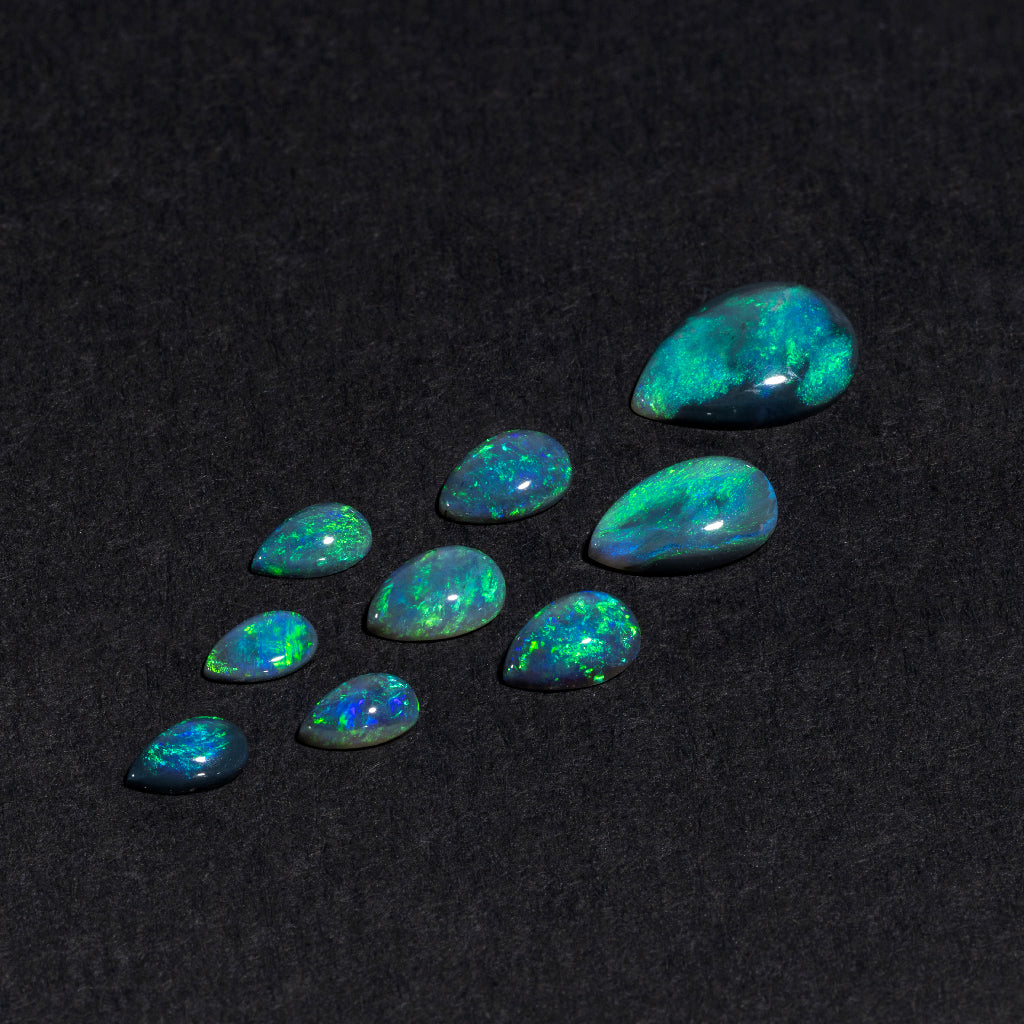 5x3 to 9x7mm Lightning Ridge Black Opal Pears – Green Play of Color