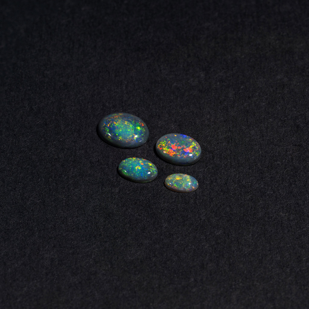 5x3 to 9x7mm Lightning Ridge Black Opal Ovals – Full-Spectrum Play of Color