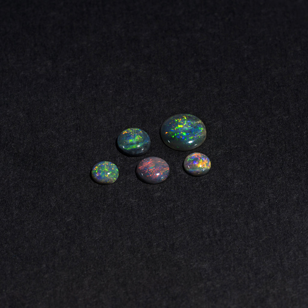 4 to 8mm Lightning Ridge Black Opal Round Cabs – Full-Spectrum Play of Color