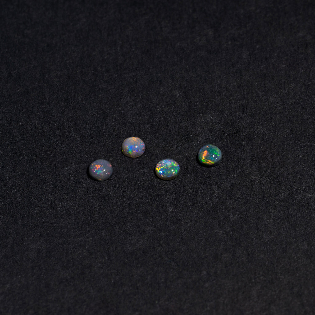 2 to 3.5mm Lightning Ridge Black Opal Round Cabs – Full-Spectrum Play of Color