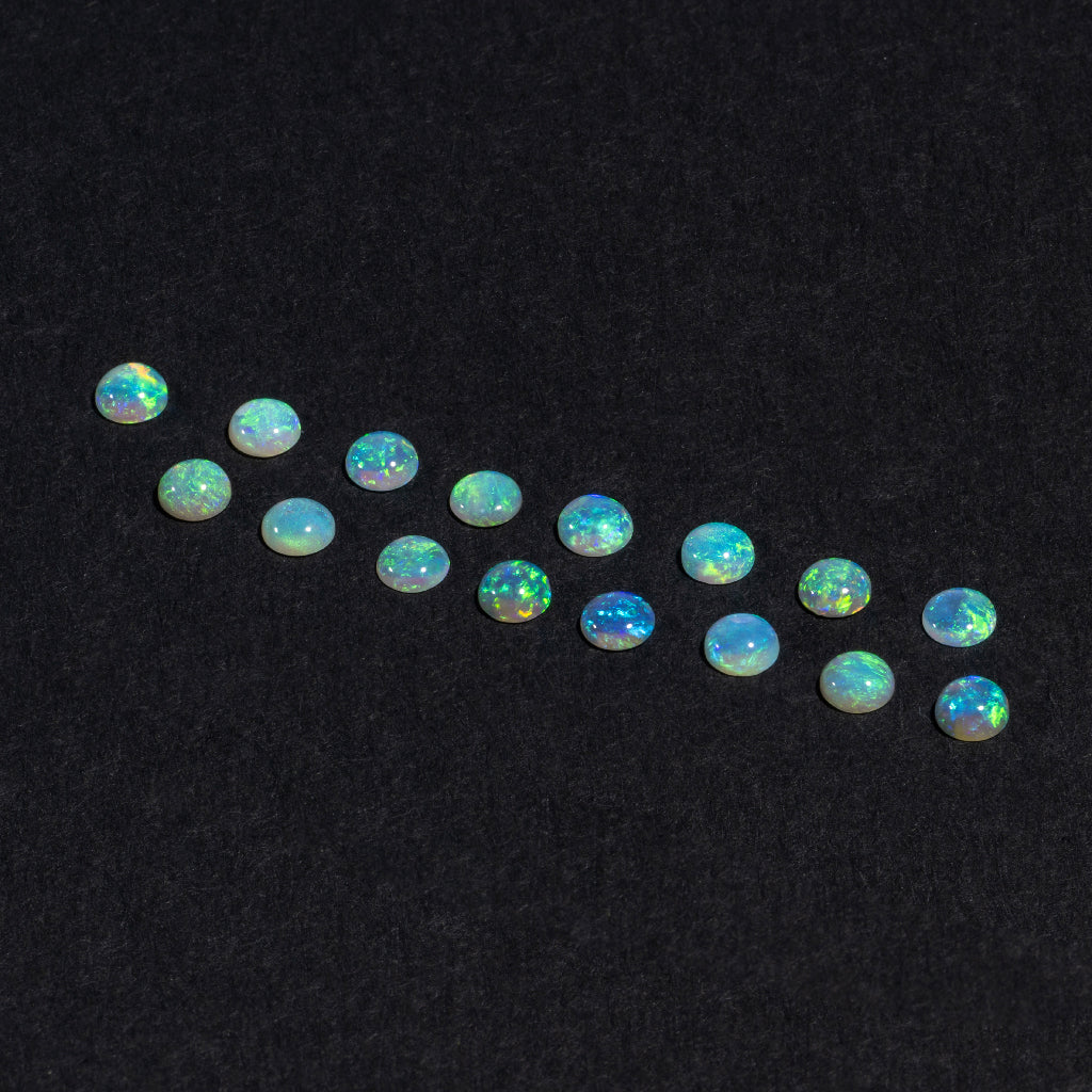 1.5 to 3.5mm Lightning Ridge Crystal Opal Round Cabs – Green Play of Color