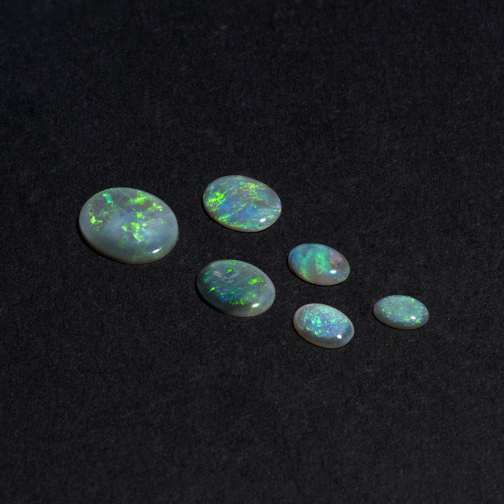5x3 to 9x7mm Lightning Ridge Semi-Black Opal Ovals – Green Play of Color