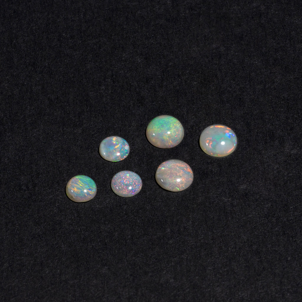 4 to 8mm Lightning Ridge White Opal Round Cabs – Orange Play of Color