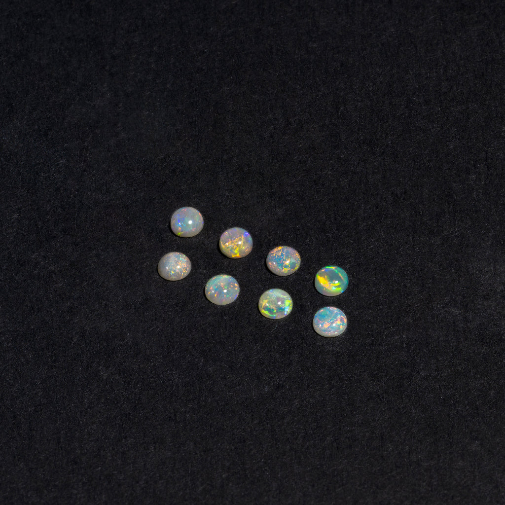 2 to 3.5mm Lightning Ridge White Opal Round Cabs – Orange Play of Color
