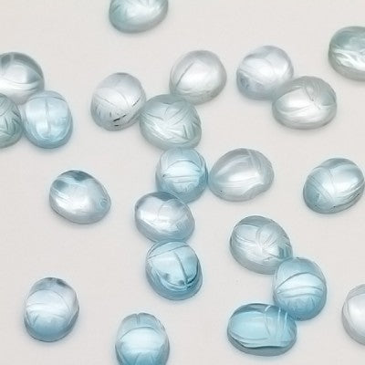 Parcel of Ten 10x8mm Sky Blue Topaz Carved Scarab Oval Cabs