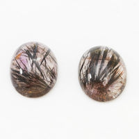 7x5 to 16x12mm Hematite in Quartz Oval Cabs