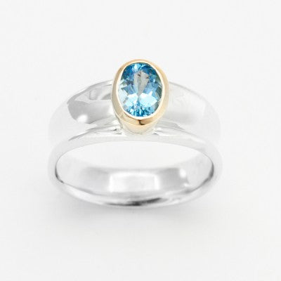 7x5mm Oval Blue Topaz Bezel Ring in 14kt Yellow Gold & SS